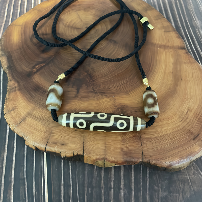 牙黄折线九眼天珠-横款-男女通用