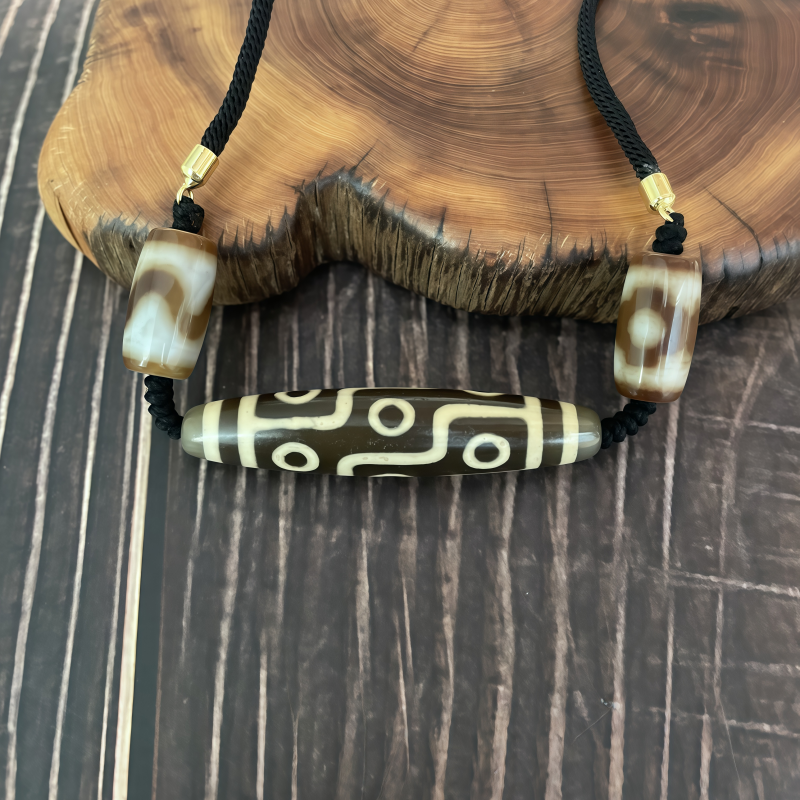 牙黄折线九眼天珠-横款-男女通用