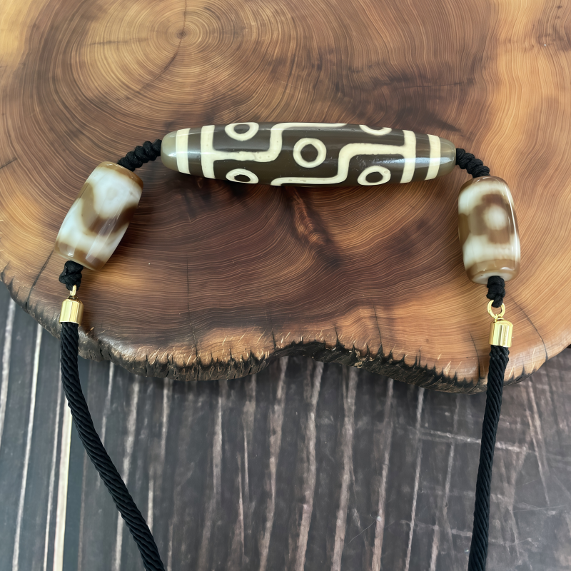 牙黄折线九眼天珠-横款-男女通用